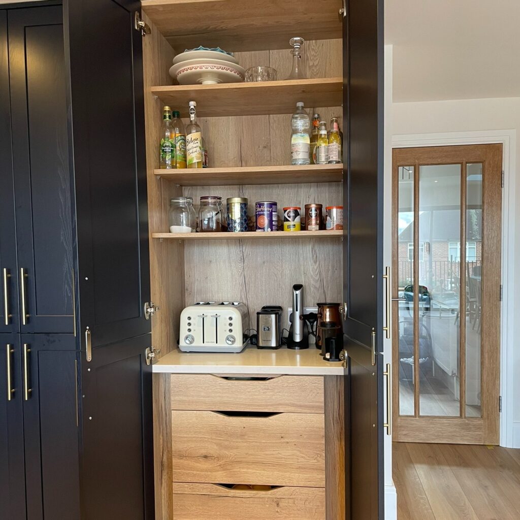 May be an image of kitchen island, sliding door, indoors and barn door