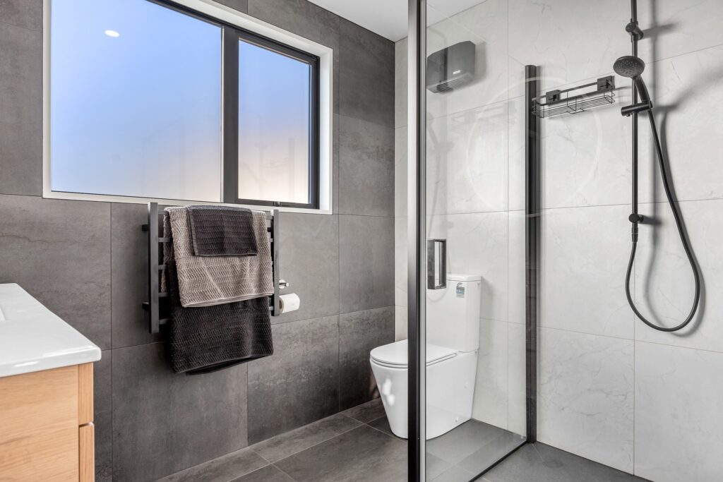 May be an image of towel rack, sink, indoors and sliding door